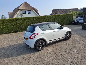 Vaurioauto  passenger cars Suzuki Swift 1.2i  5drs  airco 2013/4